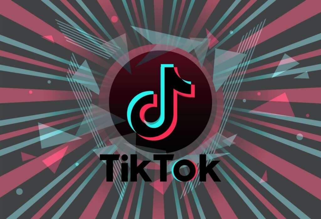 TikTok impulsa las tendencias de belleza y maquillaje en redes sociales Logo de TikTok sobre un fondo con efectos gráficos y colores corporativos de la plataforma, representando la influencia de las redes sociales en las tendencias de belleza y maquillaje.