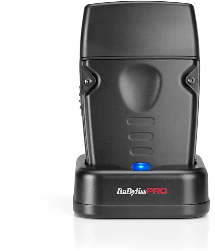 Base de carga BabylissPRO negra con afeitadora compacta profesional sobre fondo blanco.