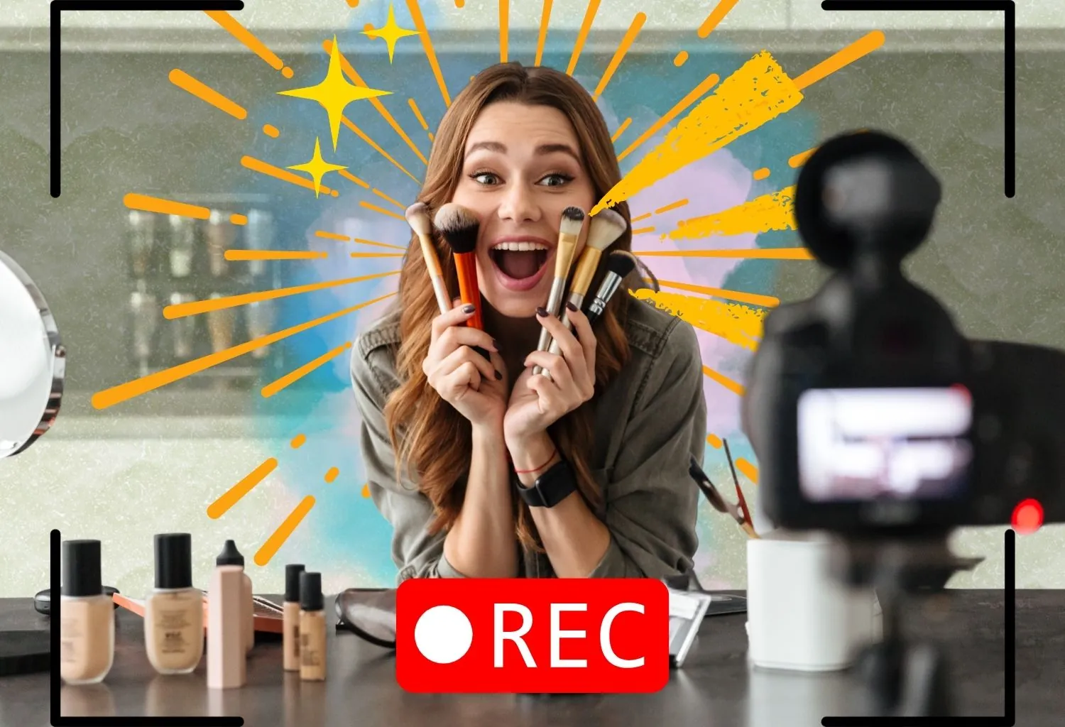 Influencer de belleza grabando un vídeo de maquillaje frente a una cámara mientras muestra brochas cosméticas durante una grabación para redes sociales.