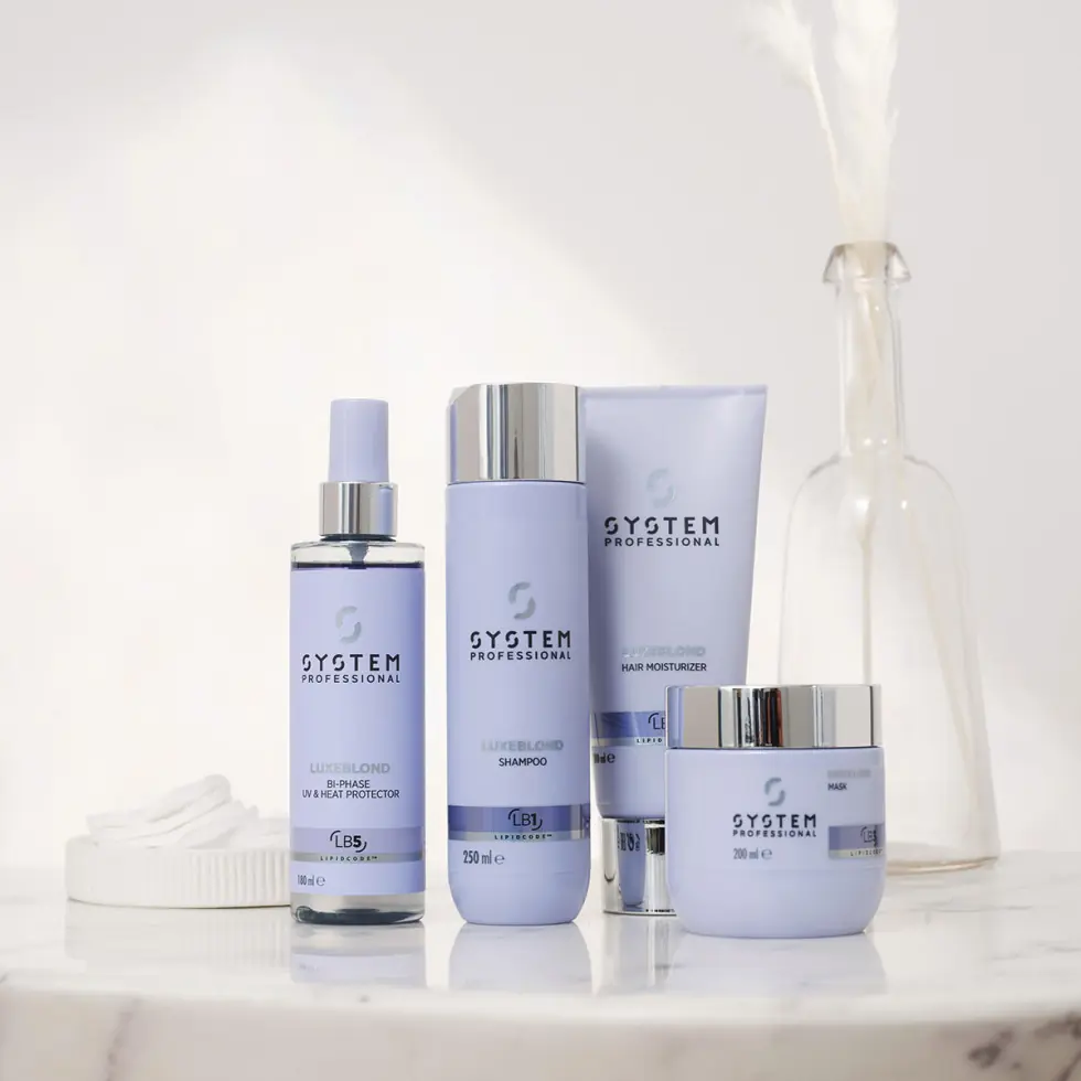 Productos de la gama LuxeBlond de System Professional para el cuidado, hidratación y protección del cabello rubio.