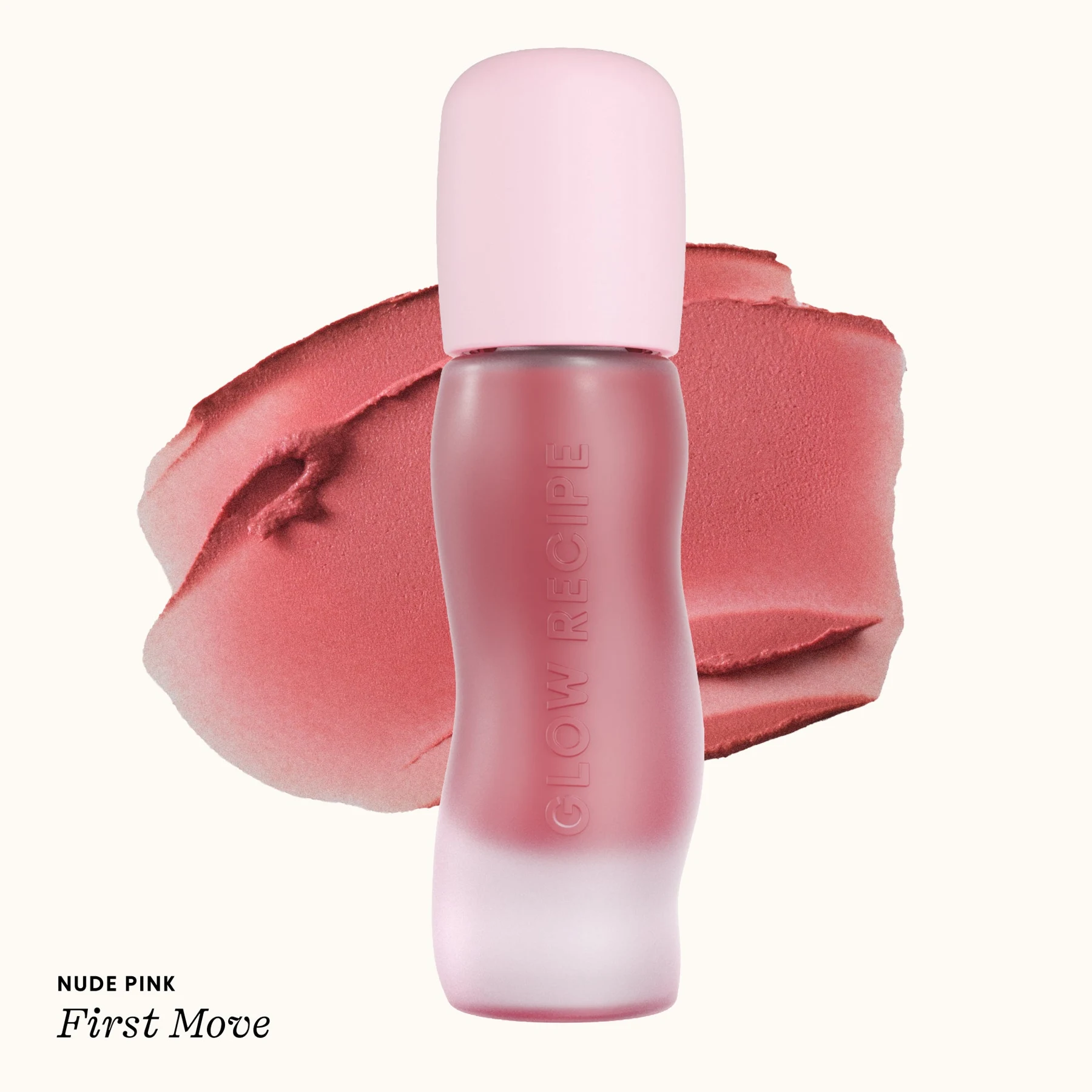 Envase de Glow Recipe Lip Blur Balm First Move sobre una muestra rosa